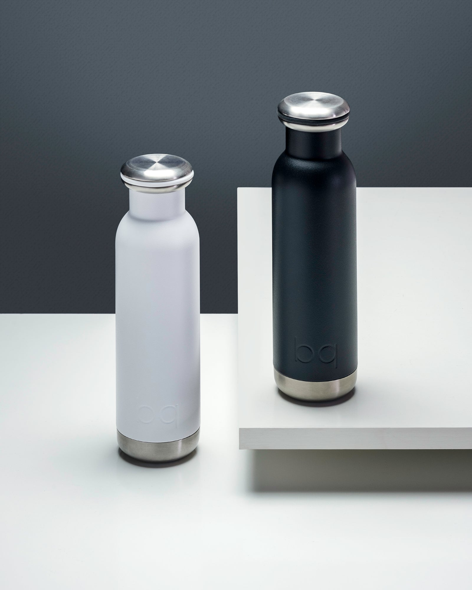2 water bottles in black and white