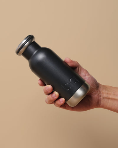 300ml black bq bottle with hand for size reference