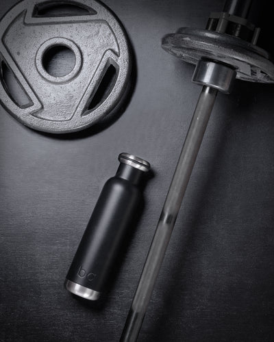all black gym essential with black water bottle