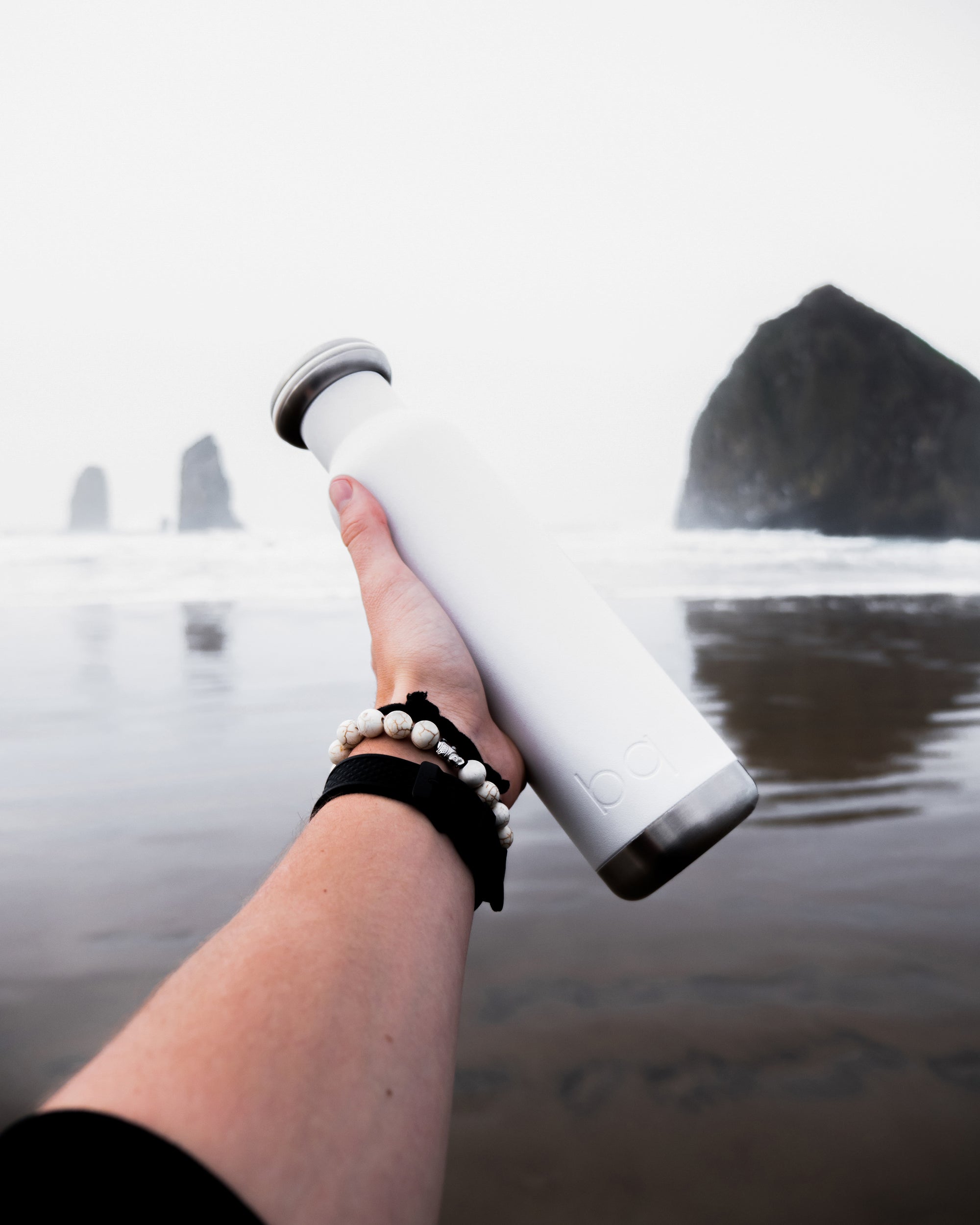spring break beach with white water bottle