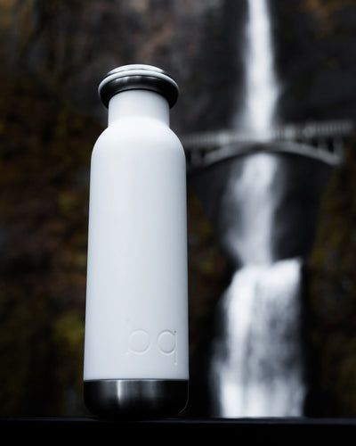 hiking waterfall with white bq bottle